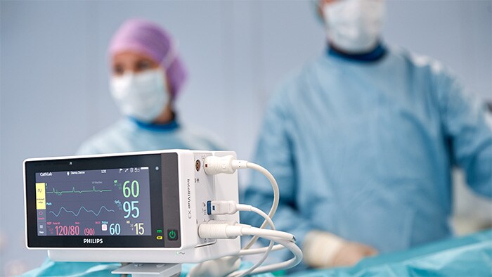 Doctors with hemodynamic system