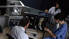 Technician explaining the Isite PACS to clinician