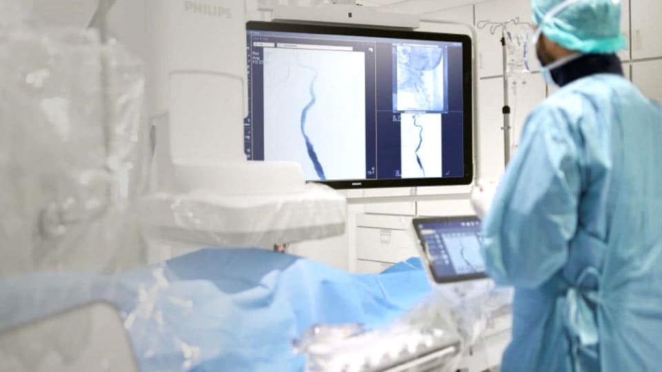 Clinician checking the scan of a patient on a monitor