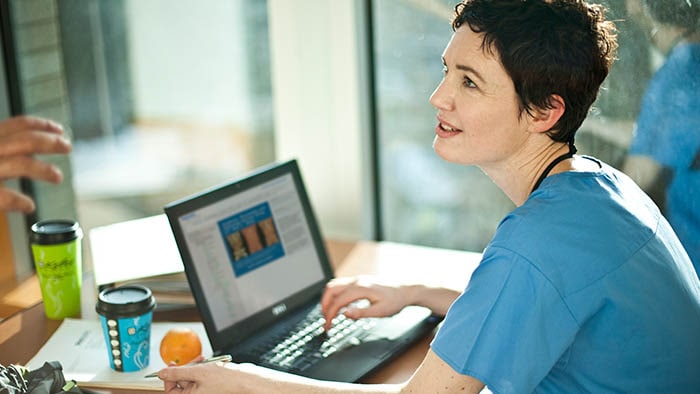 Nurse studying on online learning center