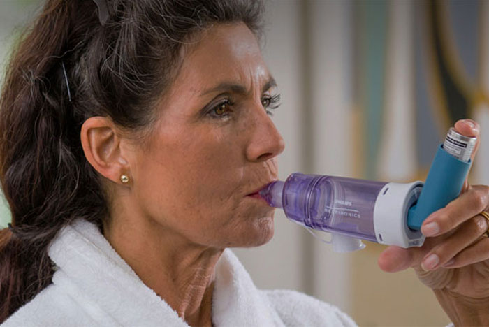 Spacer use with inhaled respiratory therapy