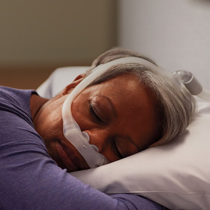 Woman sleeping with dreamwear device