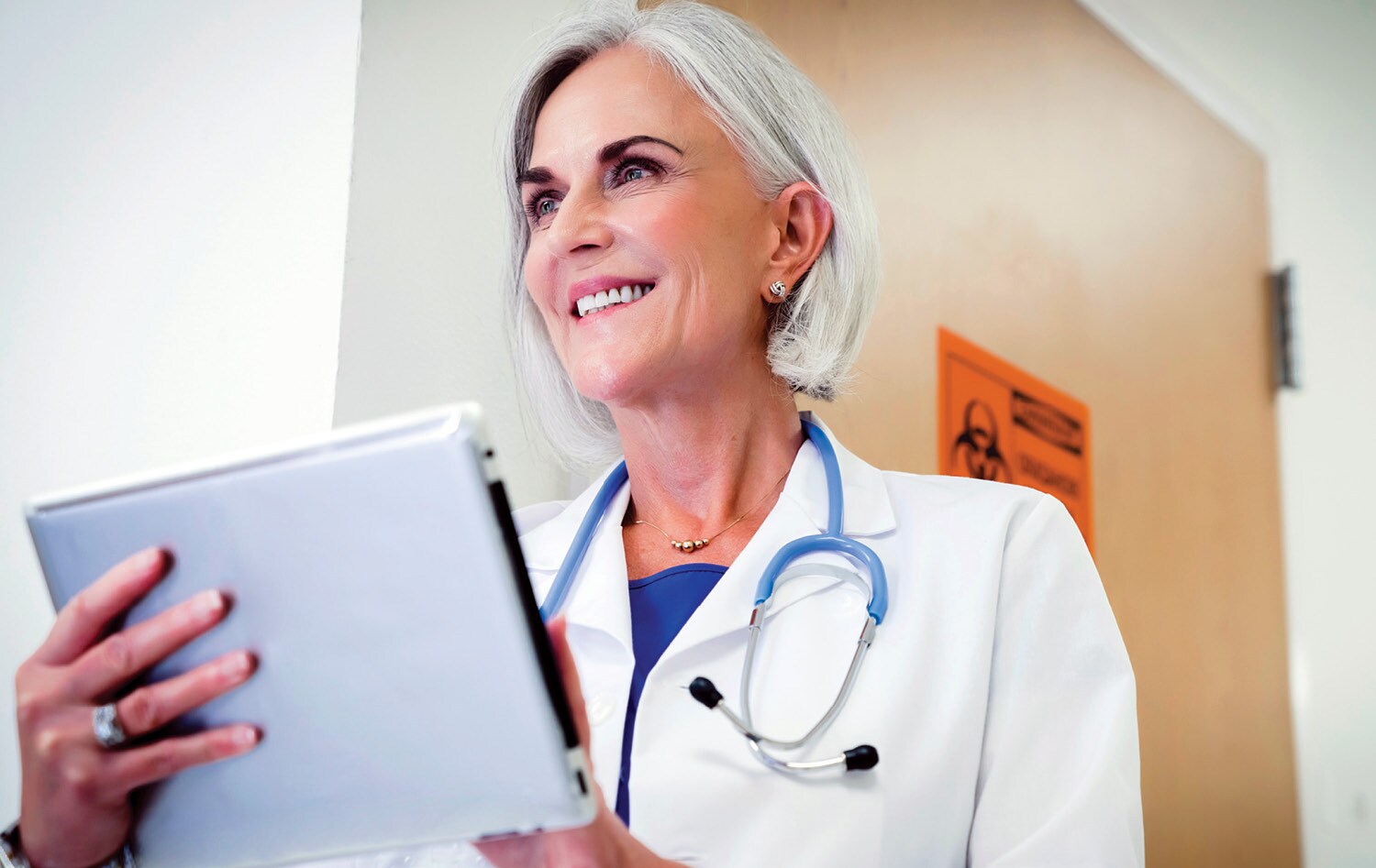 Doctor checks screen with Ipad