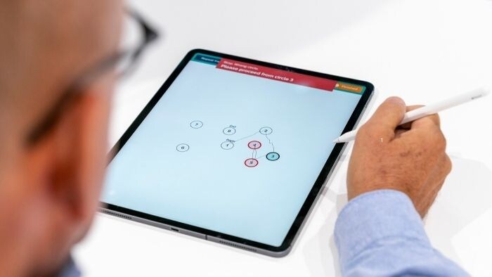 Patient performs assessment on tablet
