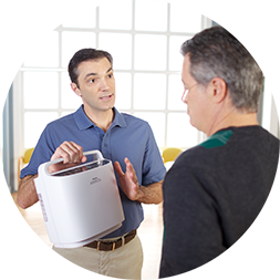 Man showing oxygen machine