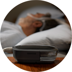Patient using sleep therapy device