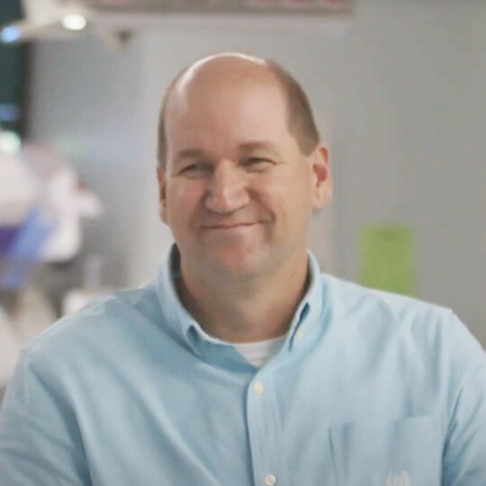 Carl smiling in doctor's office