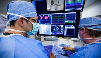 Doctors looking at a computer screen