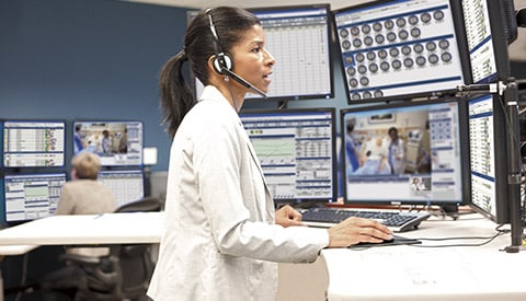 a clinician monitoring and assisting a patient over a phone call