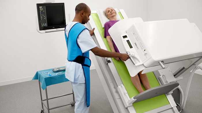 Doctor with man being scanned