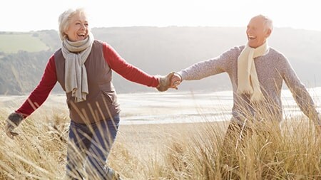 couple enjoying a walk near the sea