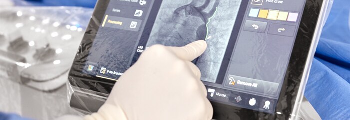 Medical professionals using touchscreen device