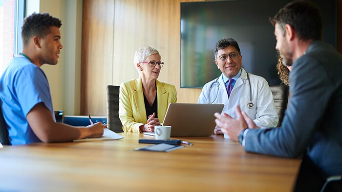 Doctor speaking with colleague