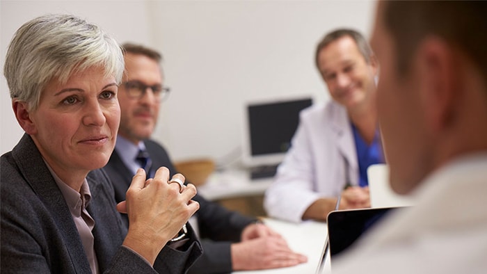 Group of men and female in a business meeting