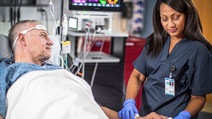 Patient and healthcare professional conversing
