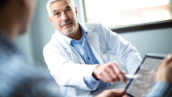 Doctor pointing to tablet