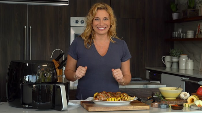 Lady making recipe with airfryer