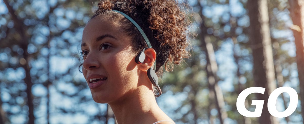 Close-up photo of a woman wearing bone conduction sports headphones