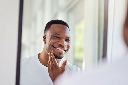 man looking in mirror