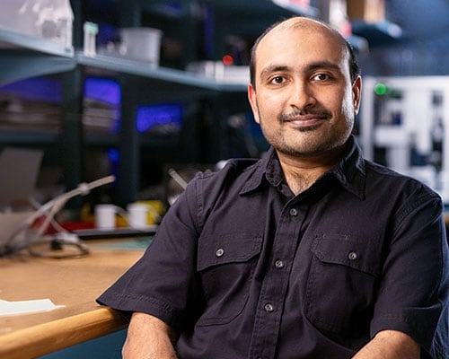 Anandh Balakrishnan sitting in lab