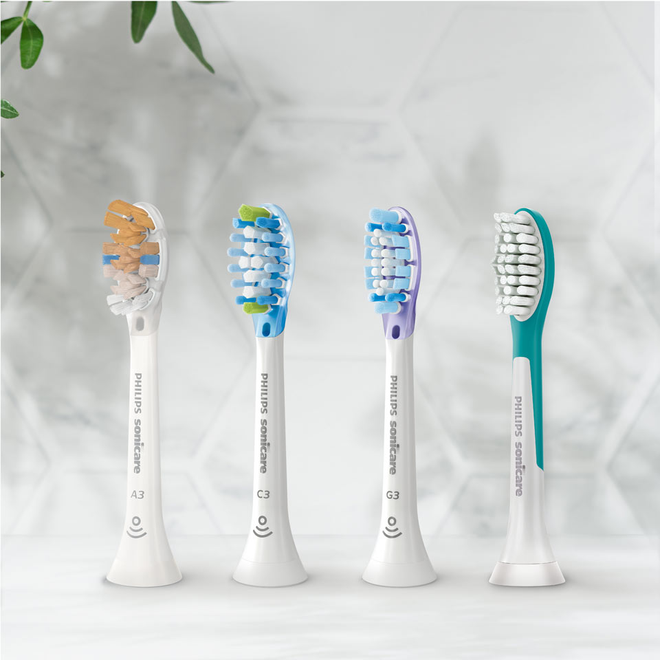 Sonicare brush heads aligned on a countertop