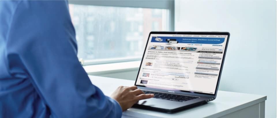 Dental professional using laptop