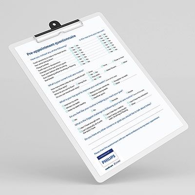 Pre-appointment questionnaire displayed on a clipboard