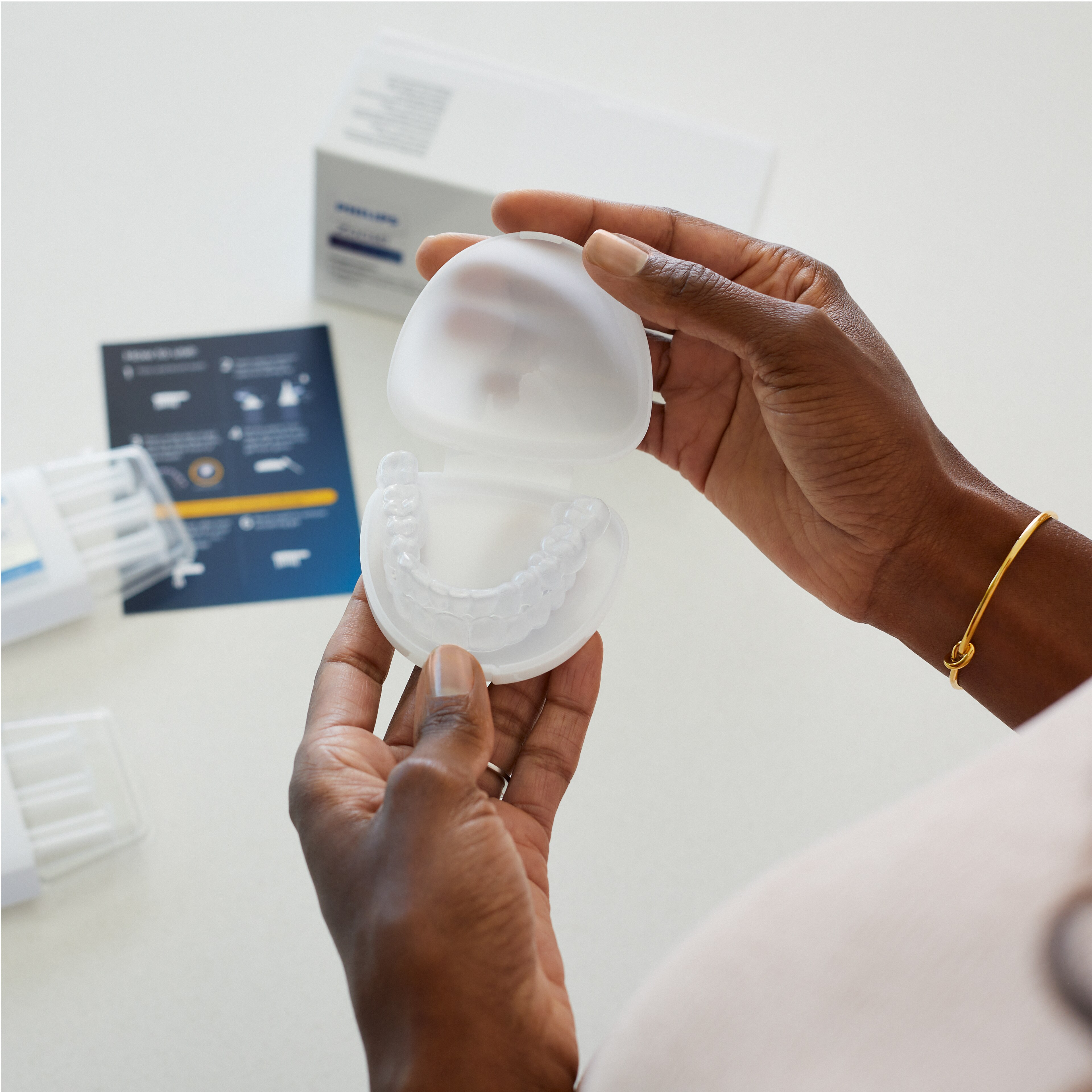 Brochure of the science behind Philips Zoom! whitening on a desk