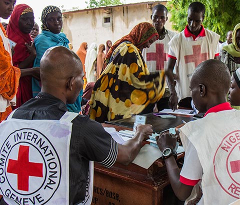 Red Cross personnel assisting with food crisis