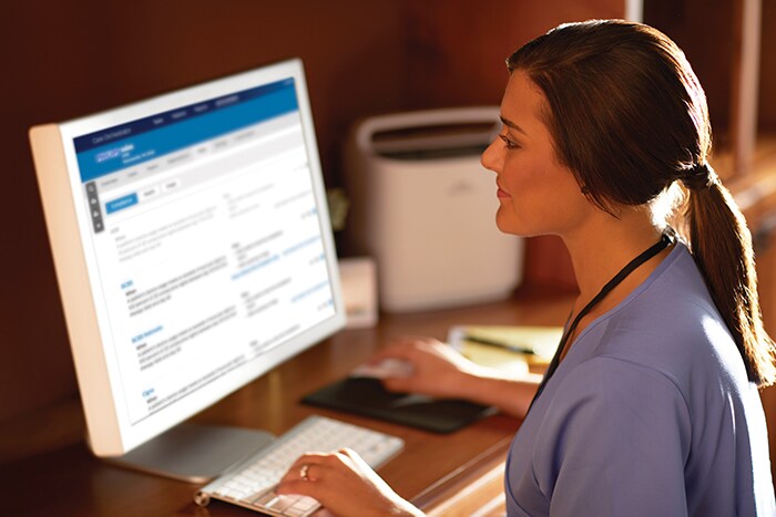 Download image (.jpg) A respiratory therapist views oxygen patient data through Care Orchestrator, Philips remote patient management system (opens in a new window)