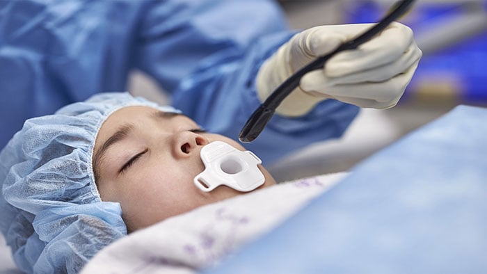 Clinician using Mini TEE 3D Transducer on pediatric patient -  