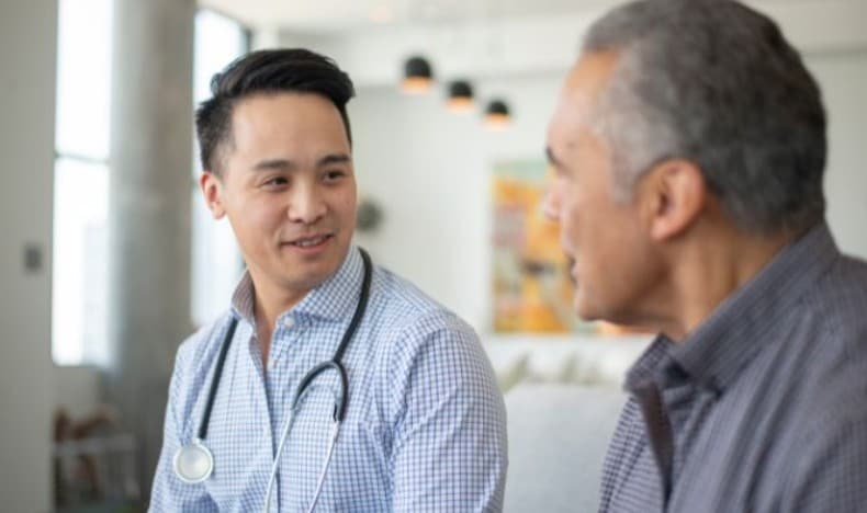Healthcare worker speaking with a patient