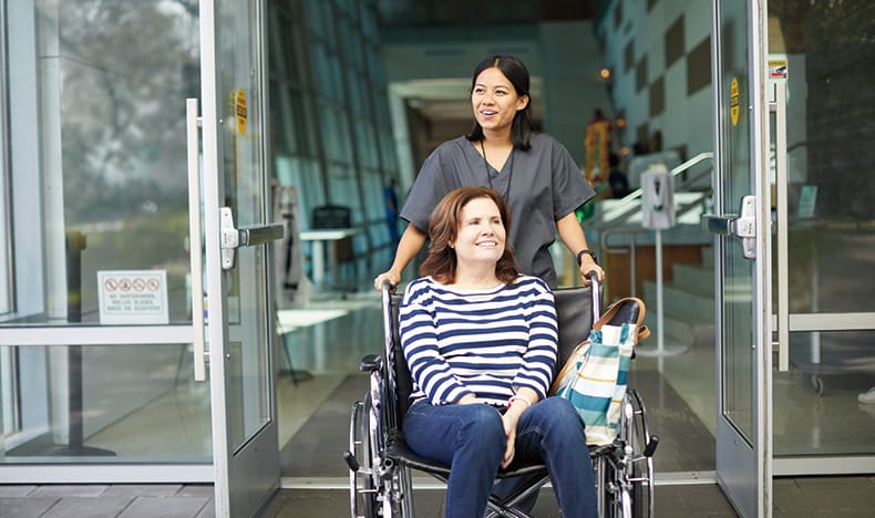 Female patient leaving hospital