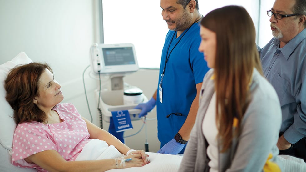 Female patient receiving care in hospital